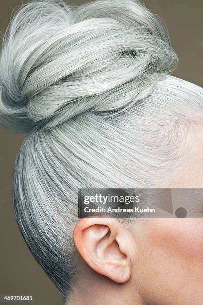 cropped image of a grey haired bun. - chignon bun photos et images de collection