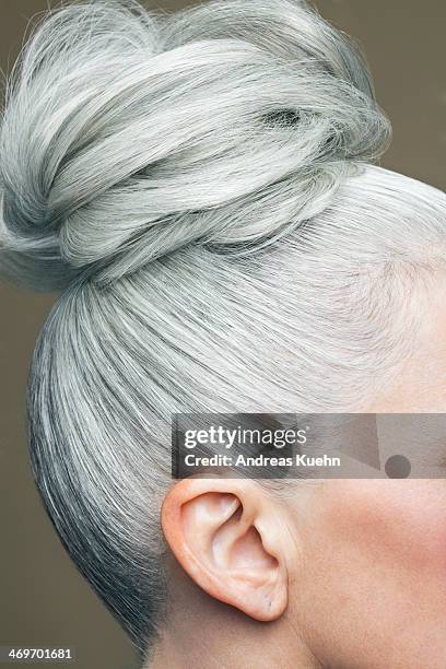 cropped image of a grey haired bun. - grey hair close up stock pictures, royalty-free photos & images