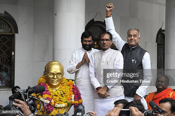 Union minister Ram Vilas Paswan, Madhya Pradesh Chief Minister Shivraj Singh Chouhan and state BJP President Nand Kumar Singh Chouhan pay tribute to...