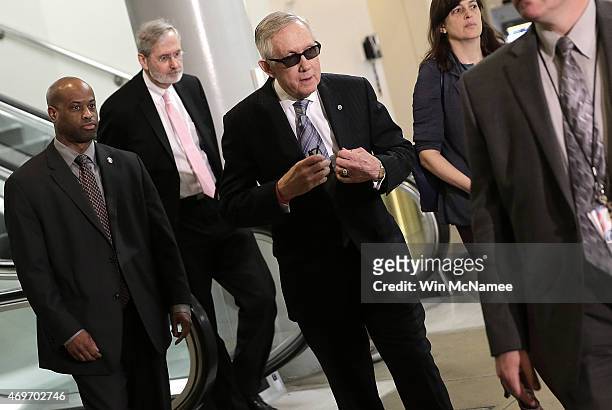 Senate Minority Leader Harry Reid arrives for a meeting with members of the U.S Senate on the proposed deal with Iran at the U.S. Capitol, April 14,...