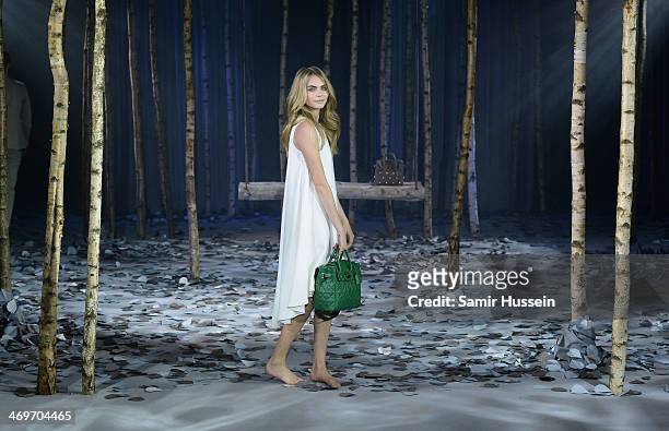 Model Cara Delevingne poses at a photocall to launch the Mulberry Cara Delevingne Collection during London Fashion Week at Claridge's Hotel on...