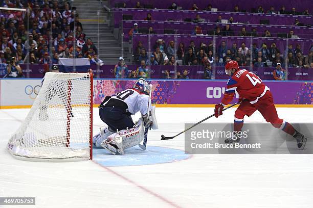 Alexander Radulov of Russia scores a goal in the shoot out against Jan Laco of Slovakia during the Men's Ice Hockey Preliminary Round Group A game on...