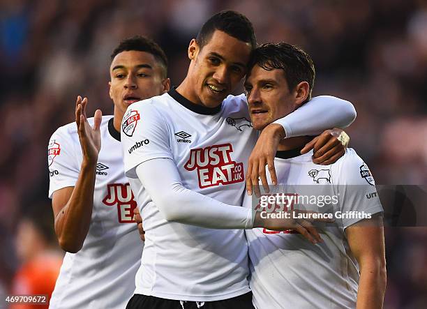 Craig Bryson of Derby County celebrates with Jesse Lingard and Tom Ince as he scores their first goal during the Sky Bet Championship match between...