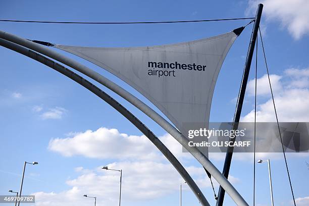 Sign hangs at the entrance to Manchester Airport in Manchester, north west England on April 7, 2015. As a general election looms, the...