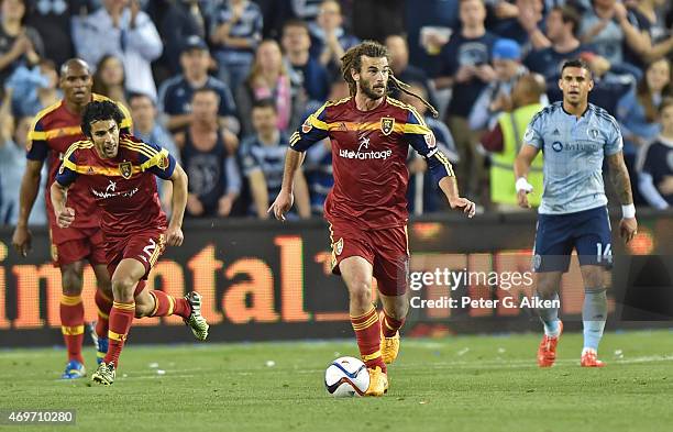 Mid-fielder Kyle Beckerman of Real Salt Lake carries the ball up field against Sporting Kansas City during the second half on April 11, 2015 at...