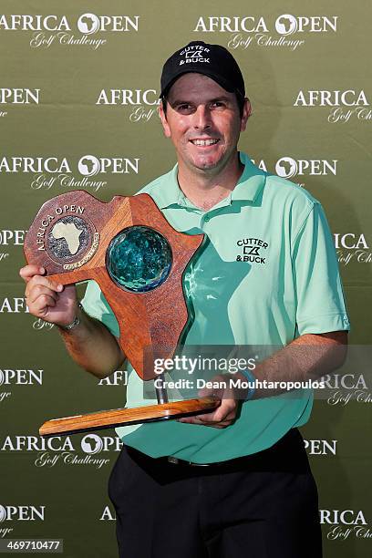 Thomas Aiken of South Africa poses with the trophy after winning the Africa Open at East London Golf Club on February 16, 2014 in East London, South...