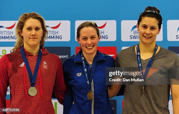 Jemma Lowe, Hannah Miley and Aimee Willmott pose on the medal podium after the Womens Open 200m Butterfly Final during Day One of the British...