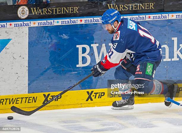 Andrew Joudrey of the Adler Mannheim handles the puck during the game between Adler Mannheim and ERC Ingolstadt on april 14, 2015 in Mannheim,...