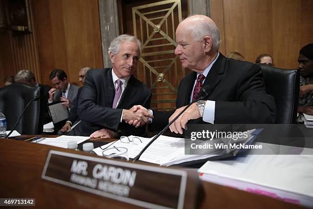 Senate Foreign Relations Committee Chairman Sen. Bob Corker shakes hands with ranking member Sen. Ben Cardin during a committee markup meeting April...