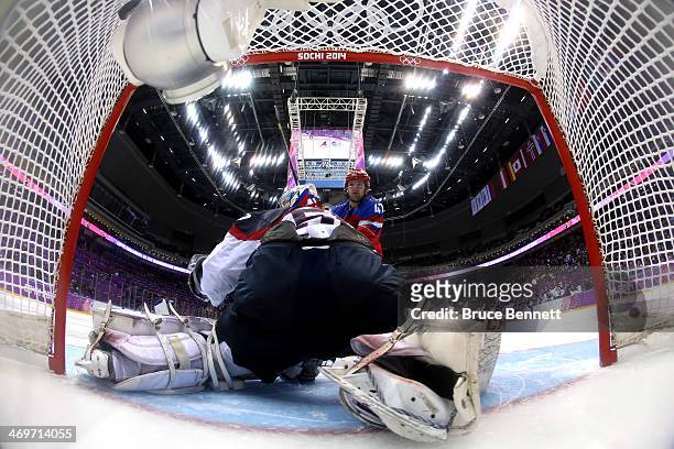 Alexander Radulov of Russia scores a goal in the shoot out against Jan Laco of Slovakia during the Men's Ice Hockey Preliminary Round Group A game on...