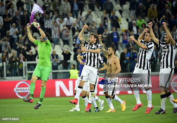 Juventus players celebrate after winning 1-0 the UEFA Champions League quarter final football match Juventus FC vs AS Monaco on April 14, 2015 at the...