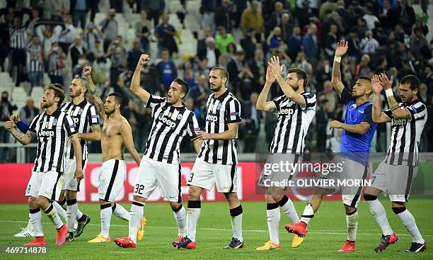 Juventus players celebrate after winning 1-0 the UEFA Champions League quarter final football match Juventus FC vs AS Monaco on April 14, 2015 at the...