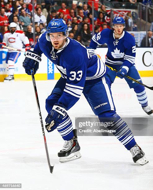 Tim Erixon of the Toronto Maple Leafs skates up the ice during NHL action against the Montreal Canadiens at the Air Canada Centre April 11, 2015 in...