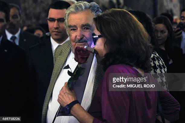 Helena Villagra, widow of Uruguayan writer Eduardo Galeano speaks with Uruguayan former President Jose Mujica during the author's wake held at the...