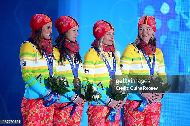 Bronze medalists Germany celebrate on the podium during the medal ceremony for the Women's 4 x 5 km Relay on day 9 of the Sochi 2014 Winter Olympics...