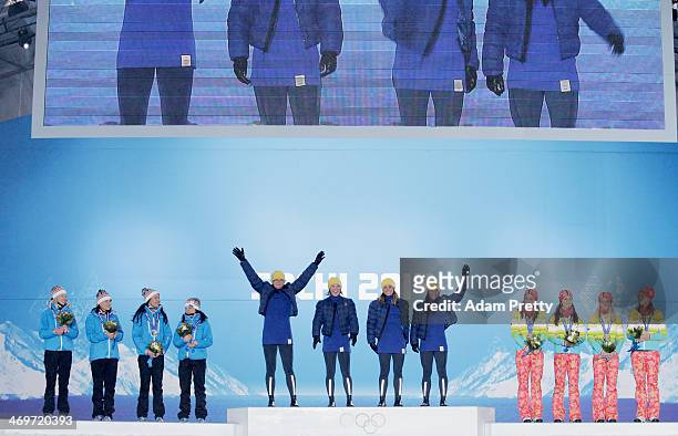 Silver medalists Finland, gold medalists Sweden and bronze medalists Germany celebrate on the podium during the medal ceremony for the Women's 4 x 5...