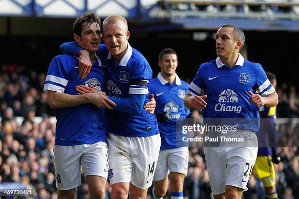 Leighton Baines of Everton celebrates his goal with team mates Steven Naismith and Leon Osman during the FA Cup Fifth Round match between Everton and...