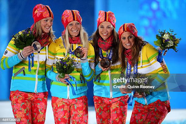 Bronze medalists Germany celebrate on the podium during the medal ceremony for the Women's 4 x 5 km Relay on day 9 of the Sochi 2014 Winter Olympics...