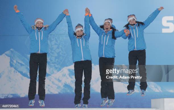 Silver medalists Finland celebrate on the podium during the medal ceremony for the Women's 4 x 5 km Relay on day 9 of the Sochi 2014 Winter Olympics...