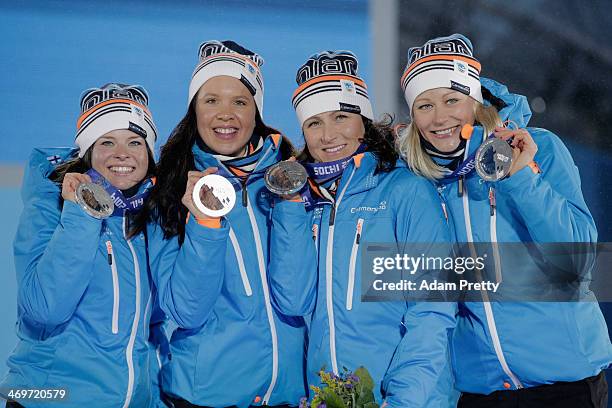 Silver medalists Finland celebrate on the podium during the medal ceremony for the Women's 4 x 5 km Relay on day 9 of the Sochi 2014 Winter Olympics...