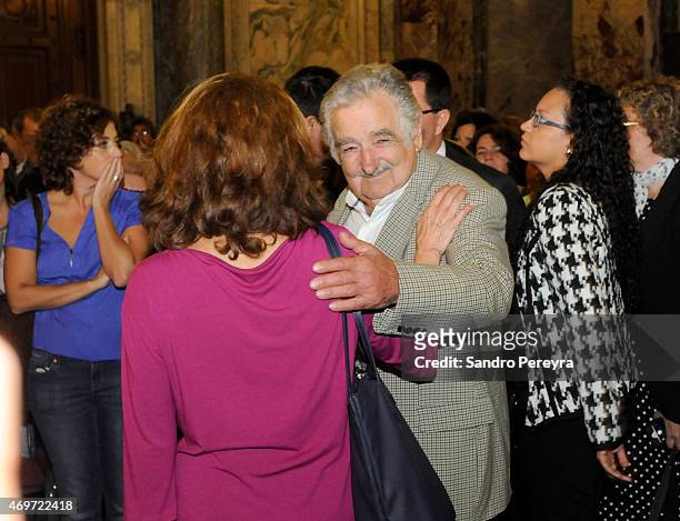 Former uruguayan president Jose Mujica and Helena Villagra widow of Eduardo Galeano talk during a funeral ceremony to honor Uruguayan writer and...