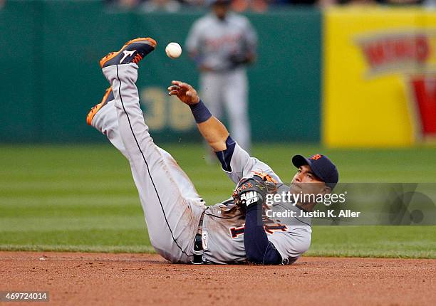 Jose Iglesias of the Detroit Tigers makes a throw from his back in the second inning during interleague play against the Pittsburgh Pirates at PNC...