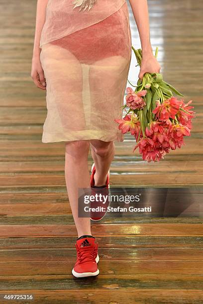 Model, dress detail, walks the runway during the Akira show at Mercedes-Benz Fashion Week Australia 2015 at Carriageworks on April 15, 2015 in...