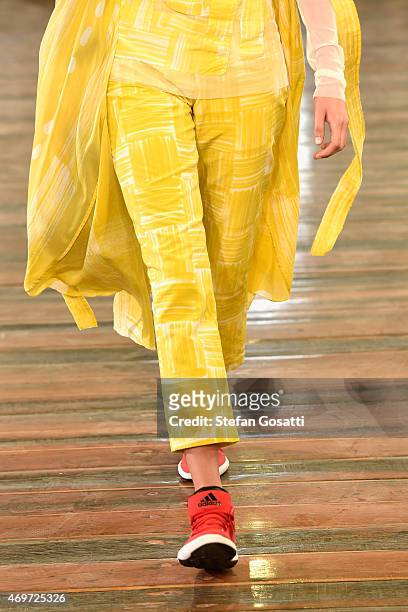 Model, dress detail, walks the runway during the Akira show at Mercedes-Benz Fashion Week Australia 2015 at Carriageworks on April 15, 2015 in...
