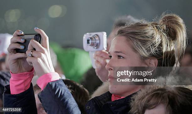 Fans take photogrpahs during the medal ceremony on day 9 of the Sochi 2014 Winter Olympics at Medals Plaza on February 16, 2014 in Sochi, Russia.