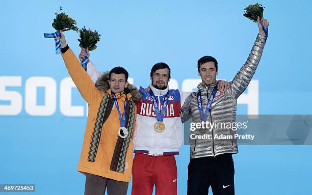 Silver medalist Martins Dukurs of Latvia, gold medalist Alexander Tretiakov of Russia and bronze medalist Matthew Antoine of United States celebrate...