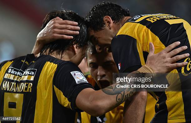 Paraguays Federico Santander of Guarani celebrates scoring against Perus Sporting Cristal with teammates during their Copa Libertadores football...