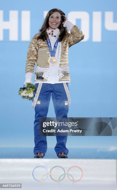 Gold medalist Eva Samkova of the Czech Republic celebrates on the podium during the medal ceremony for the Womens Snowboard Cross on day 9 of the...