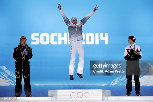 Silver medalist Koen Verweij of Netherlands, gold medalist Zbigniew Brodka of Poland and bronze medalist Denny Morrison of Canada celebrate on the...