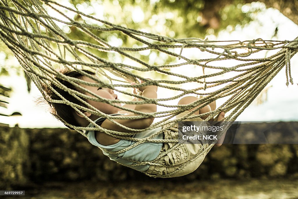 Chinese baby sleep in the hammock