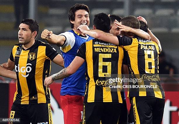 Paraguays Guarani team members celebrate after winning in their Copa Libertadores footballm match against Peru's Sporting Cristal held at the...