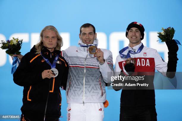 Silver medalist Koen Verweij of Netherlands, gold medalist Zbigniew Brodka of Poland and bronze medalist Denny Morrison of Canada celebrate on the...