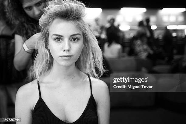 Model gets ready at the backstage during day one of Mercedes-Benz Fashion Week Mexico Fall/Winter 2015 at Campo Marte on April 14, 2015 in Mexico...