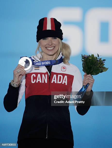 Silver medalist Dominique Maltais of Canada celebrates on the podium during the medal ceremony for the Womens Snowboard Cross on day 9 of the Sochi...