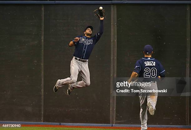 Kevin Kiermaier of the Tampa Bay Rays makes a catch against the wall in the ninth inning during MLB game action against the Toronto Blue Jays on...