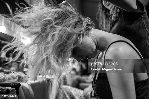 Model gets ready at the backstage during day one of Mercedes-Benz Fashion Week Mexico Fall/Winter 2015 at Campo Marte on April 14, 2015 in Mexico...