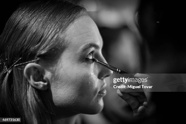 Model gets ready at the backstage during day one of Mercedes-Benz Fashion Week Mexico Fall/Winter 2015 at Campo Marte on April 14, 2015 in Mexico...