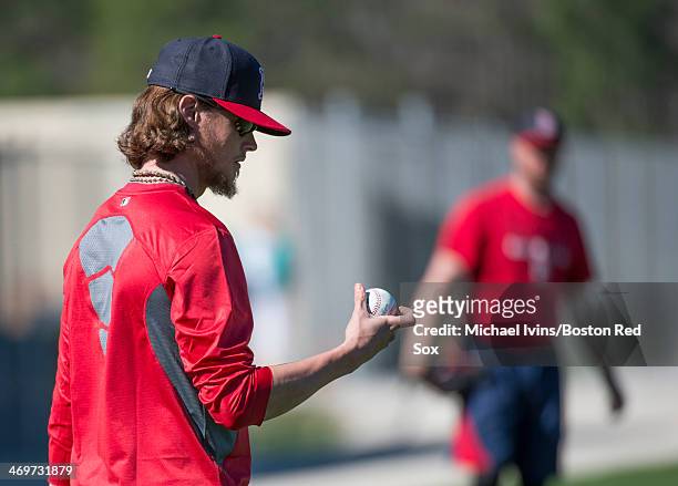 Clay Buchholz of the Boston Red Sox throws during a Spring Training workout at Fenway South on February 16, 2014 in Fort Myers, Florida.