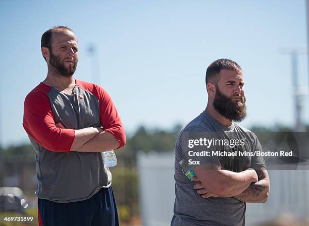 Dustin Pedroia and Mike Napoli of the Boston Red Sox listen as Ryan Dempster announces that he will not pitch during the 2014 season during a press...