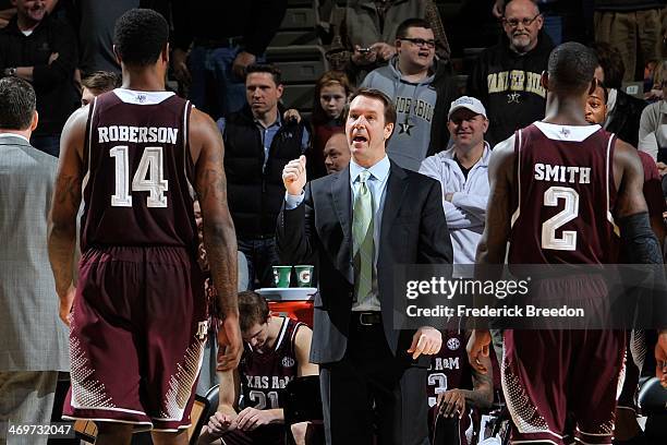 Head coach Billy Kennedy of Texas A&M coaches Kourtney Roberson during a game against the Vanderbilt Commodores at Memorial Gym on February 15, 2014...