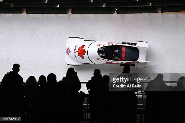 Pilot Lyndon Rush and Lascelles Brown of Canada team 1 make a run during the Men's Two-Man Bobsleigh heats on Day 9 of the Sochi 2014 Winter Olympics...