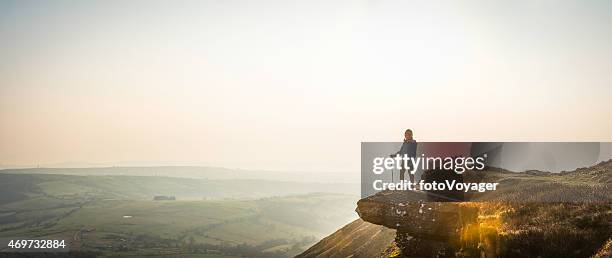 young hiker looking out over mountain valley misty dawn panorama - dal bildbanksfoton och bilder