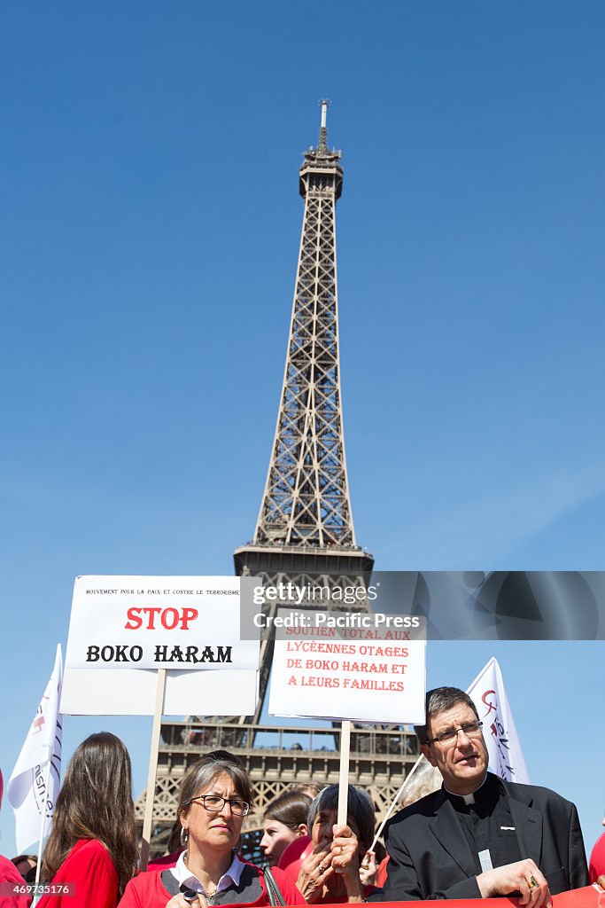 Protesters with the "Bring Back Our Girls" campaign stand in...