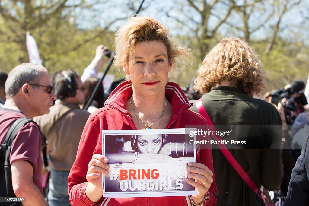 Frigide Barjot holds a placard reading "Bring back our girls...