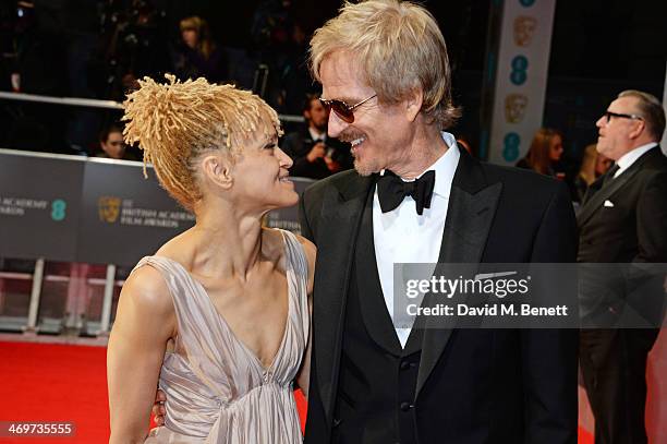 Caridad Rivera and Matthew Modine attend the EE British Academy Film Awards 2014 at The Royal Opera House on February 16, 2014 in London, England.