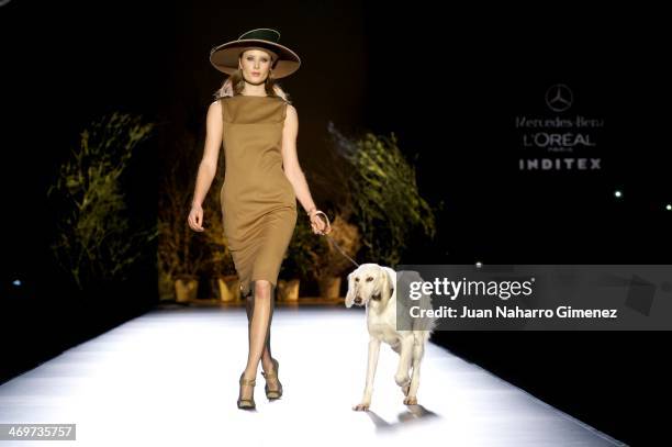 Model showcases designs by Ion Fiz on the runway at Ion Fiz show during Mercedes Benz Fashion Week Madrid Fall/Winter 2014 at Ifema on February 16,...